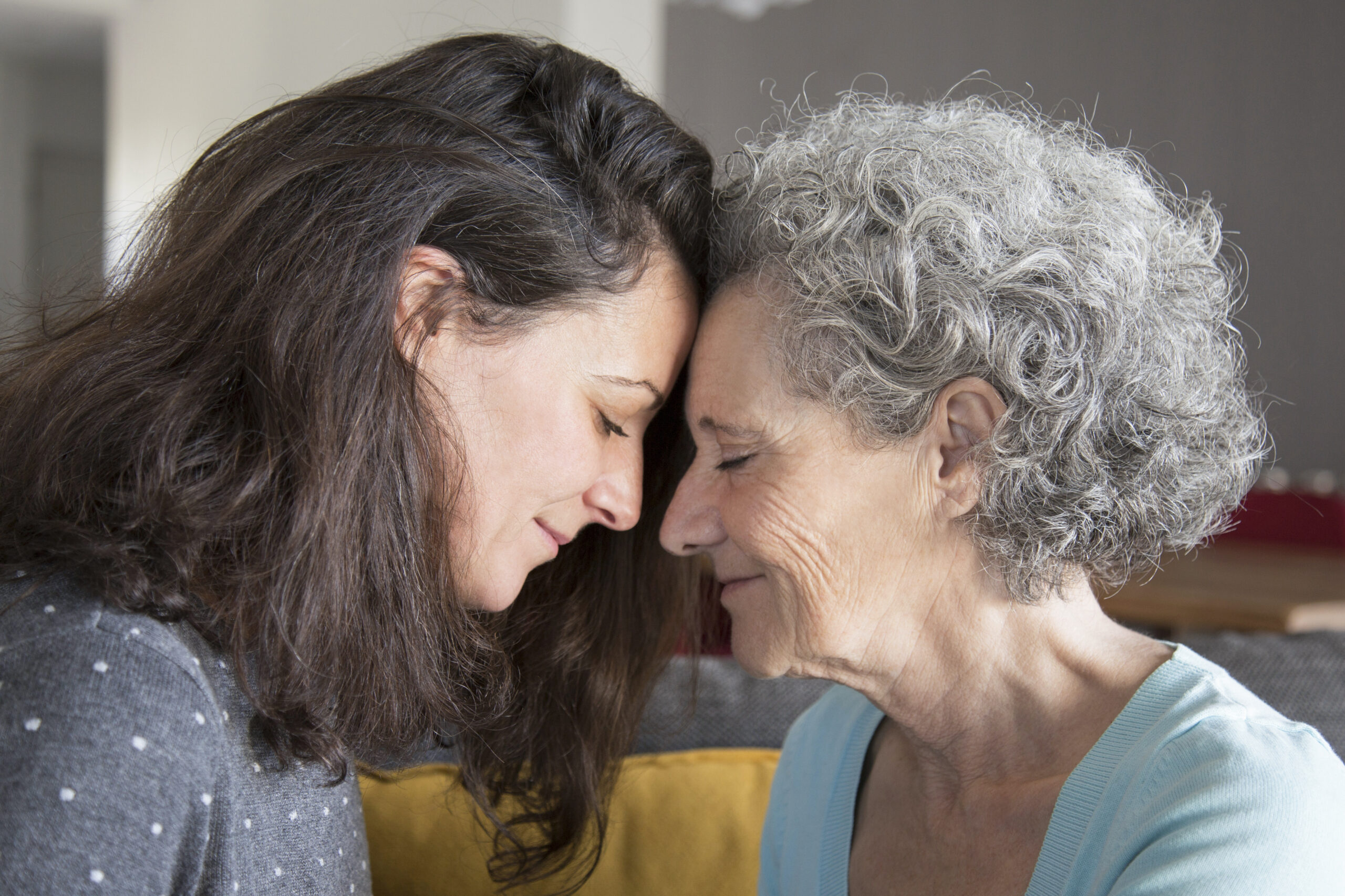 calm senior mother and daughter supporting each other scaled