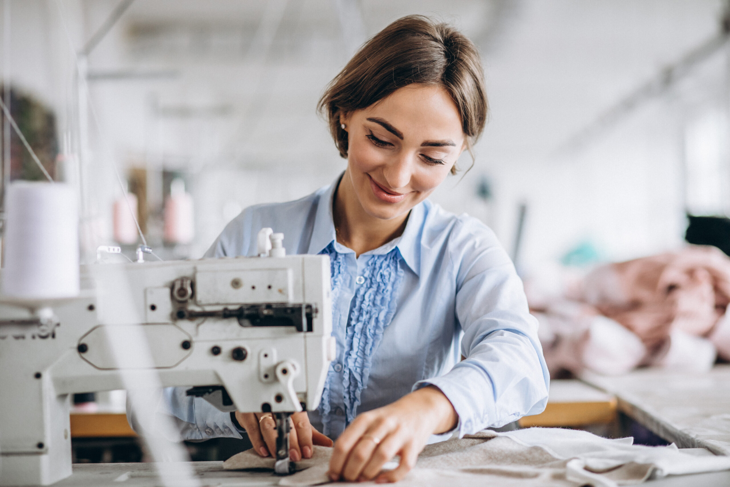 woman tailor working at the sewing factory scaled